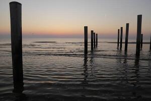 sunset in the pole village of Petten in the Netherlands photo