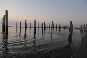 sunset in the pole village of Petten in the Netherlands photo