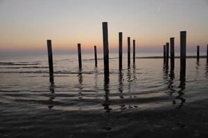 sunset in the pole village of Petten in the Netherlands photo