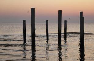sunset in the pole village of Petten in the Netherlands photo