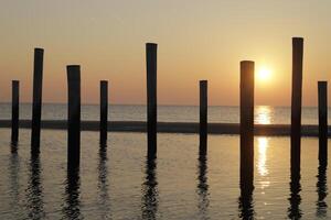 sunset in the pole village of Petten in the Netherlands photo