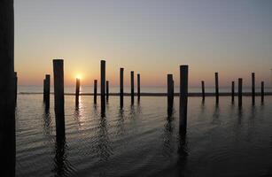 sunset in the pole village of Petten in the Netherlands photo