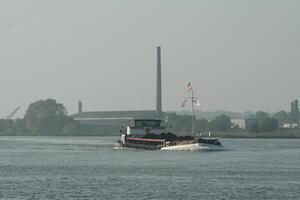 overloaded ship on a river photo