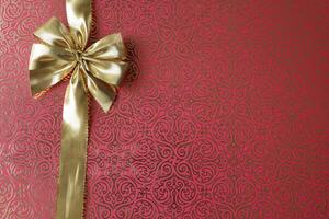 golden ribbon on red background photo