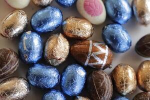 easter chocolate eggs colorful wrapped in foil photo