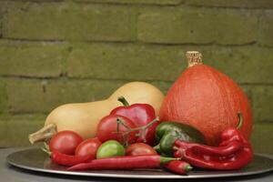 a plate with Fresh vegetables picked fresh from the garden photo