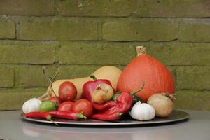 a plate with Fresh vegetables picked fresh from the garden photo