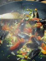 cooking mussels in spanish style photo