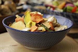 a bowl with crispy baked vegetables, healthy lifestyle photo