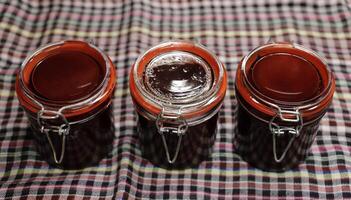 3 jam jars with homemade jam photo