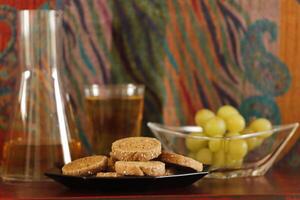 breakfast with bread, grapes and apple juice photo