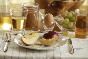 continental breakfast with tea, juice, bread and egg photo