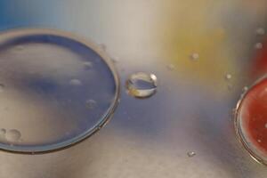 creative photography, oil drops on water with colors photo