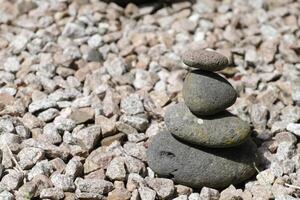 piled pebbles on stones photo