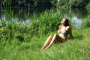 young woman basking in the sun photo