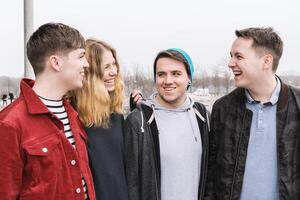 group of young friends having fun and laughing together photo