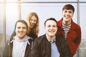 group of young friends having fun and laughing together photo