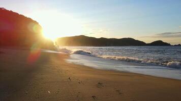 Raging sea in the morning at dawn Waves roll on the rocky shore Spray soars into the sky video