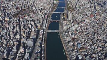 Tokyo, Japan - January 27, 2024. Aerial view Sumida River Tokyo serene artery bustling city Sumida River mirror Tokyo's dynamic spirit. Sumida River Japan's heart beats melding nature urban energy. video