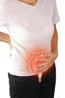 Asian woman suffering from stomachache. Chronic gastritis, menstruation and health concept. photo