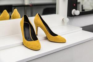 Women's elegant classic high-heeled shoes in yellow photo