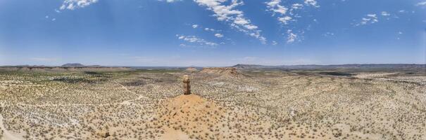 Drone panorama of the landscape around the famous Vingerklip rock needle in northern Namibia during the day photo