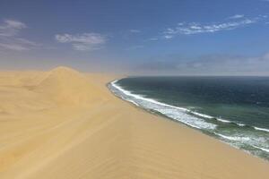 Picture of the dunes of Sandwich Harbor in Namibia on the Atlantic coast during the day photo