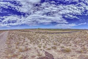 Panoramic picture over the Namibian Kalahari with blue sky and light clouds photo