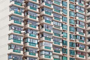 Image of a facade of a high-rise building with uniform shapes and structures photo