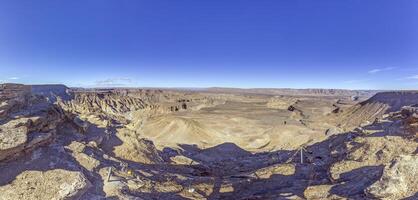 Panoramic picture of the Fish River Canyon in Namibia taken from the upper edge of the south side photo