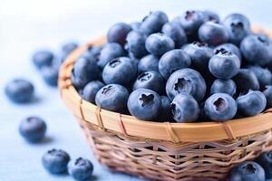 Fresh blueberry in wooden basket on white background.. photo