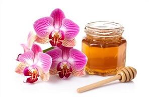 Honey with pink orchid flower isolated on white background.. photo