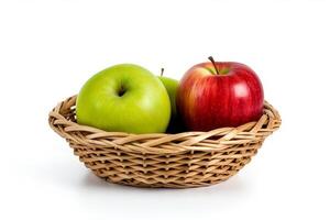 Green apple and red apple in wicker basket isolated on white background.. photo