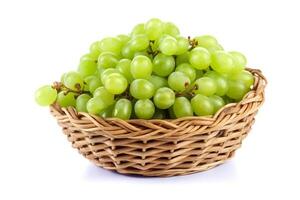 Green grape in wicker basket isolated on white background.. photo