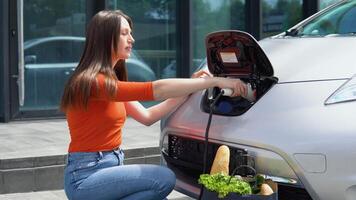 Girl starts charging her electric car video