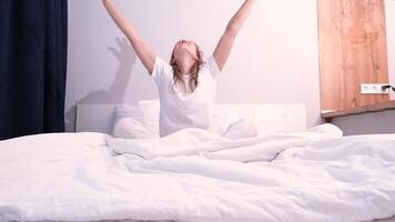 morning routines. Woman stretching in bed after wake up video