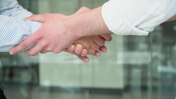 Close up two men shake hands, conclude successful contract agreement, sign of support for partnership cooperation video