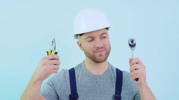 Handyman in overalls showing his tools video