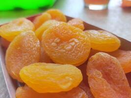 Dried Apricots in paper box container photo