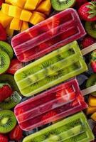 A colorful array of fruit popsicles arranged on ice bucket photo