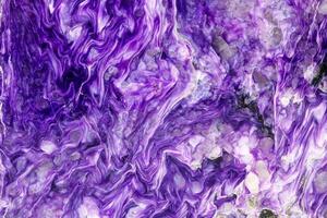 Macro stone Charoite mineral on white background photo