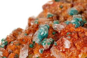 Macro stone mineral Wulfenite on a white background photo