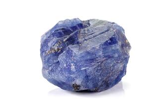 Macro blue tourmaline mineral stone on white background photo