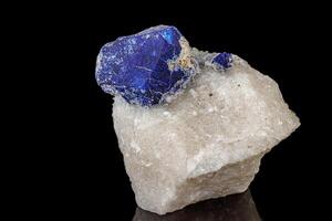 Macro of mineral stone Lazurite on a black background photo