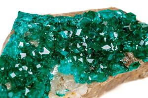 Macro mineral stone Dioptase silicate copper on a white background photo