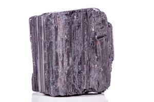 macro mineral stone sherle, schorl, black tourmaline on white background photo