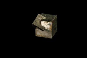 Macro mineral stone Pyrite on a black background photo