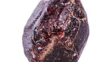 Macro of a mineral garnet stone on a white background photo