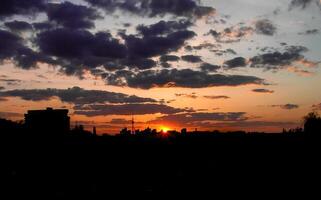 Autumn red sunset with a purple sky photo