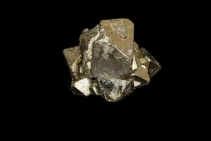 Macro mineral stone Pyrite on a black background photo